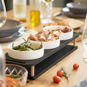 HOTTY TapasBar with ceramic bowls on a wooden serving board, ideal for organized tapas and snacks.