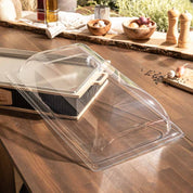 Transparent polycarbonate lid on wooden table for Hotty Legacy grill.